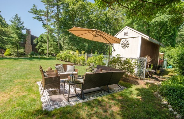 328 Mendall Road Acushnet, MA 02743 - Photo 25 of 30 a view of a chairs and table in backyard