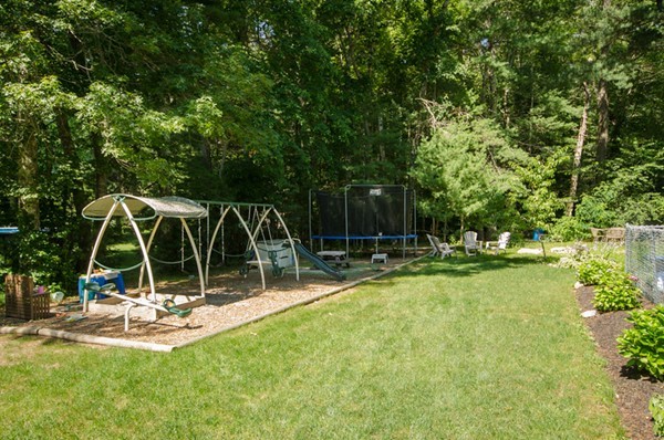 328 Mendall Road Acushnet, MA 02743 - Photo 27 of 30 a view of a swimming pool with a bench and trees