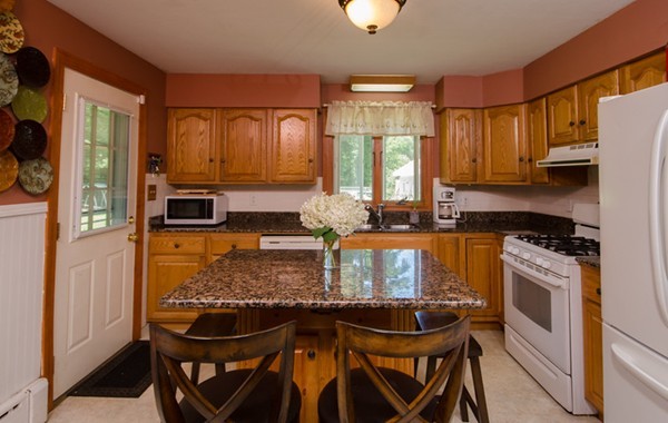 328 Mendall Road Acushnet, MA 02743 - Photo 9 of 30 a kitchen with granite countertop a stove a sink and a refrigerator