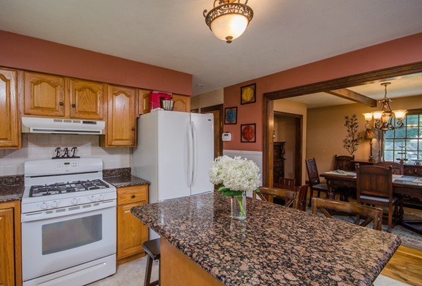 328 Mendall Road Acushnet, MA 02743 - Photo 10 of 30 a kitchen with refrigerator and cabinets