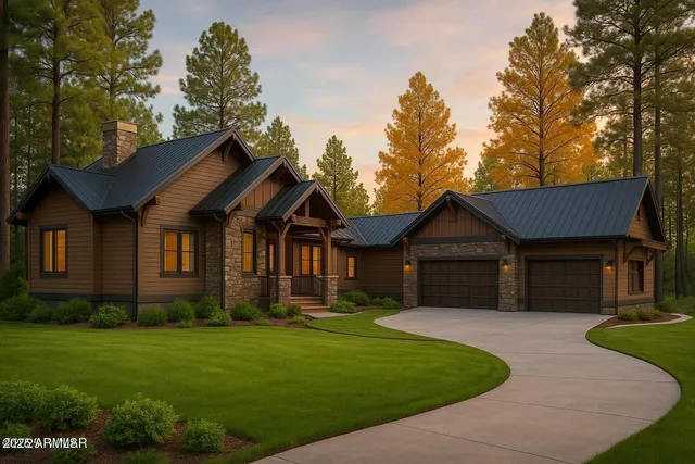 a front view of a house with a yard and trees