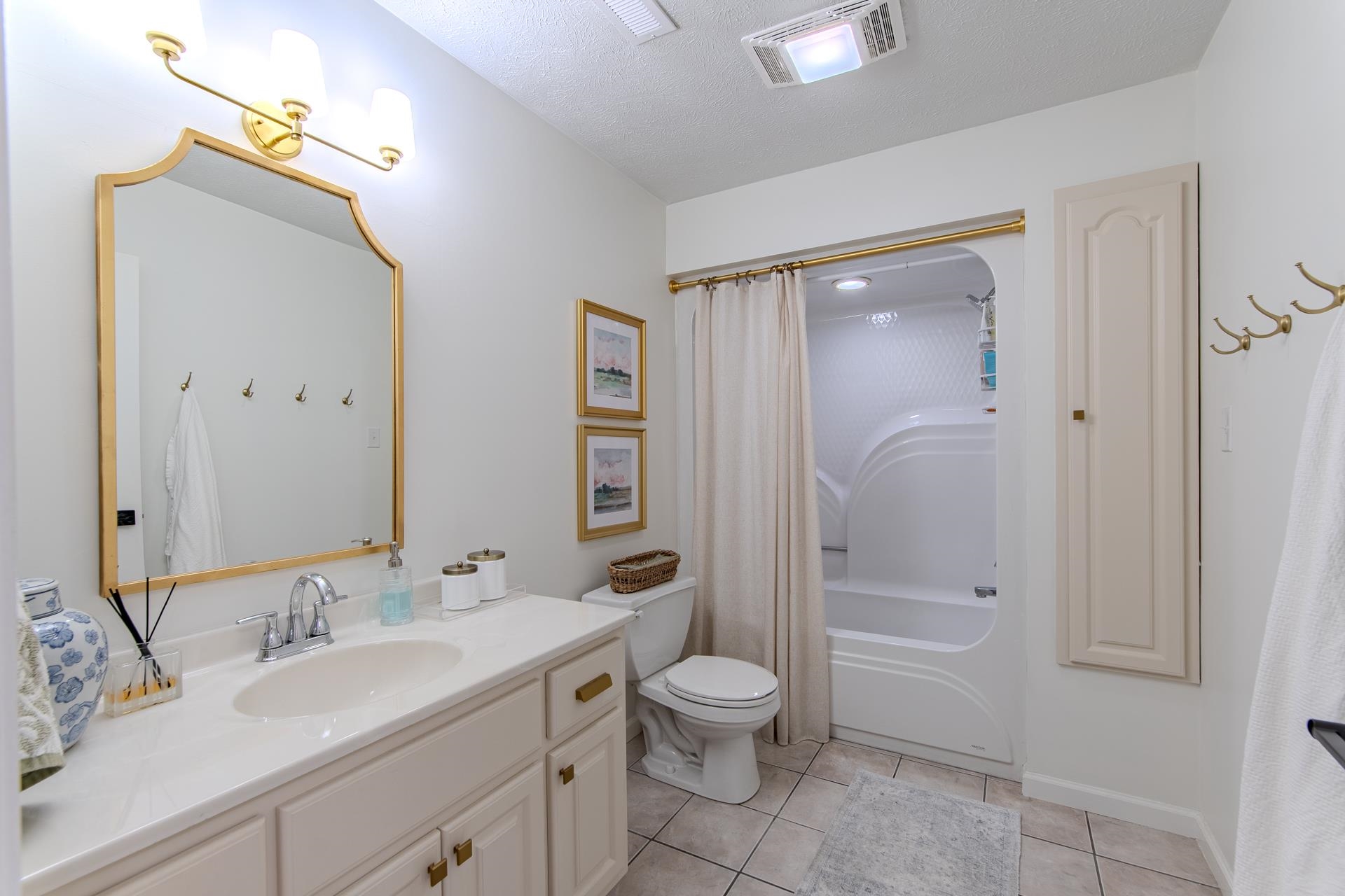 224 Willow Drive Adamsville, TN 38310 - Photo 13 of 40 a bathroom with a sink a toilet and shower