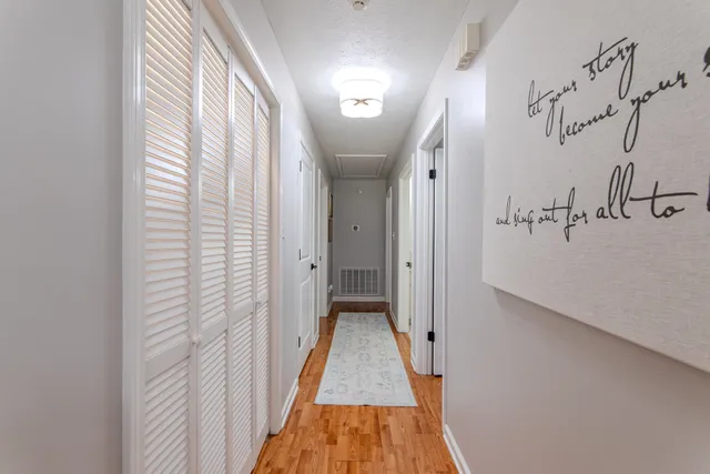 a view of a hallway with a white walls