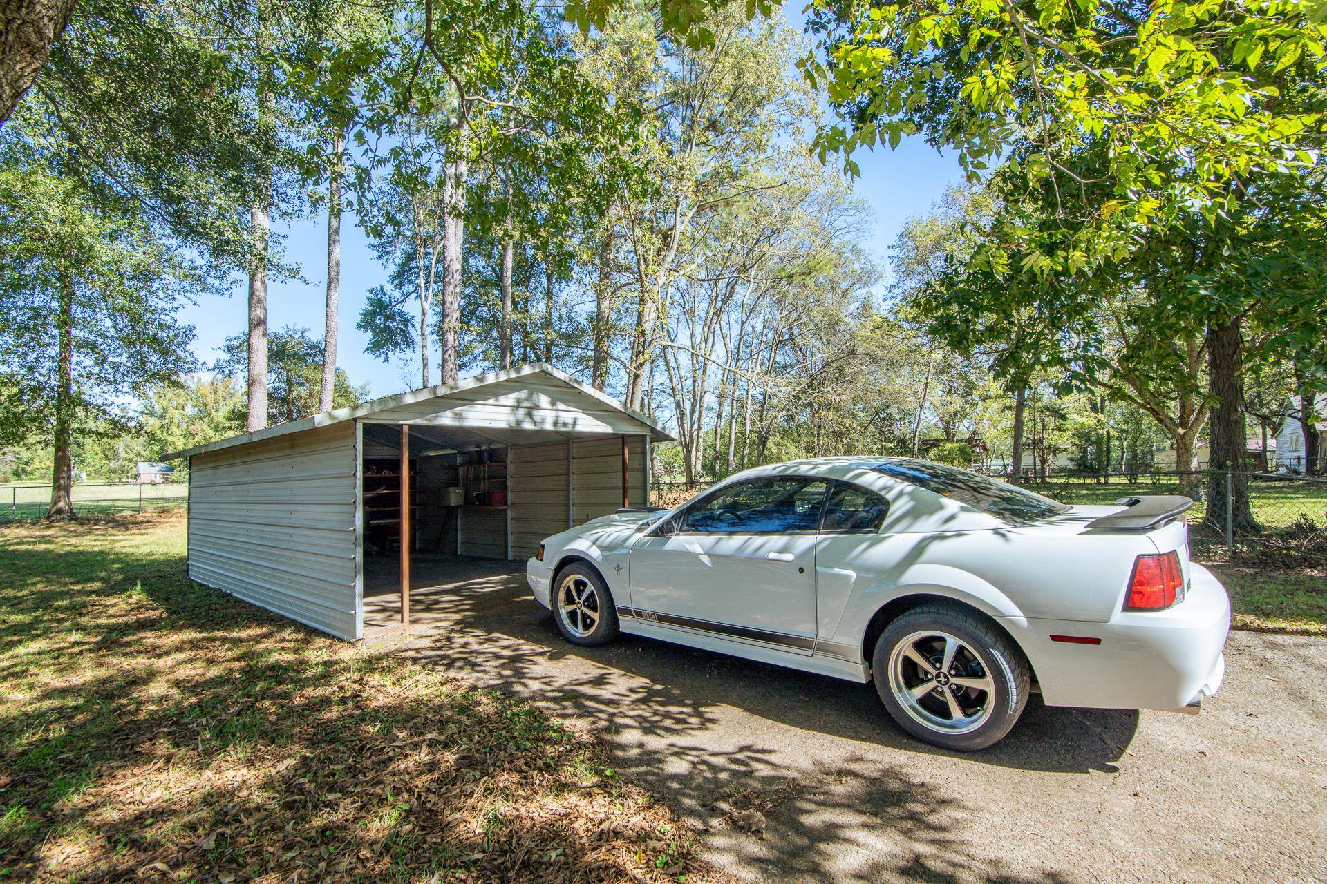 224 Willow Drive Adamsville, TN 38310 - Photo 20 of 40 a view of a car in front of a house