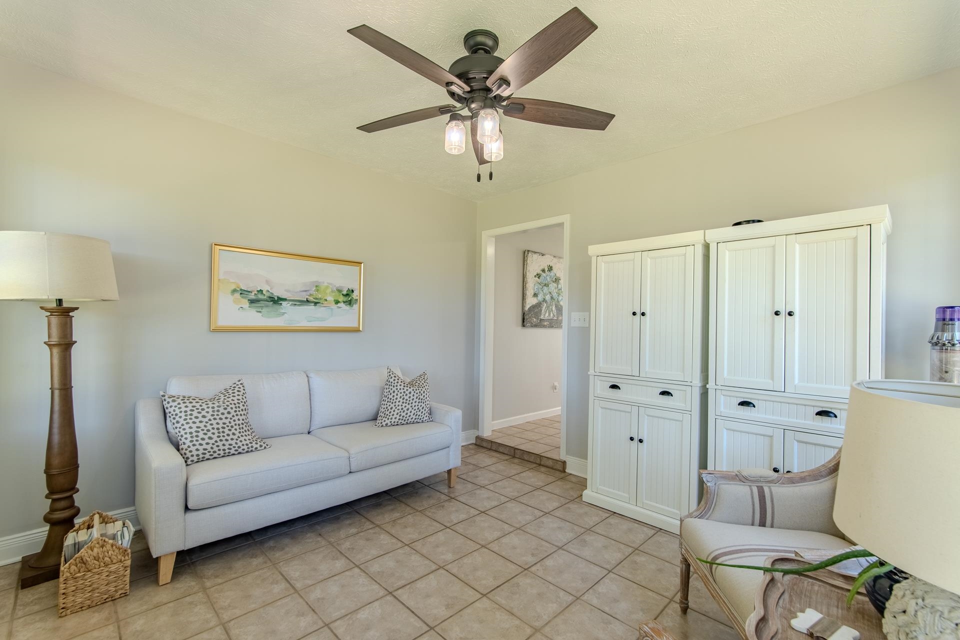 224 Willow Drive Adamsville, TN 38310 - Photo 29 of 40 a living room with furniture and a ceiling fan