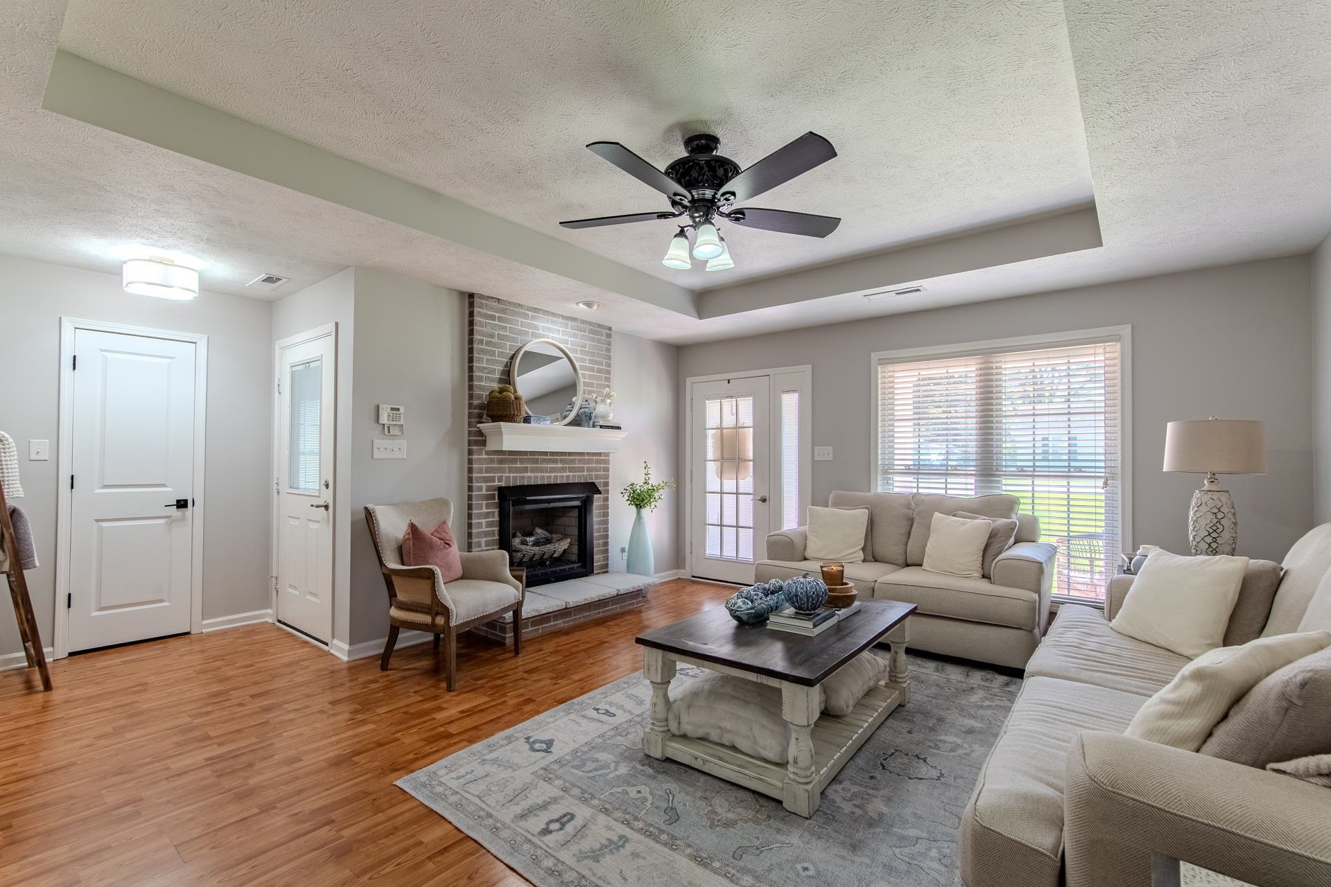 224 Willow Drive Adamsville, TN 38310 - Photo 32 of 40 a living room with furniture and a fireplace