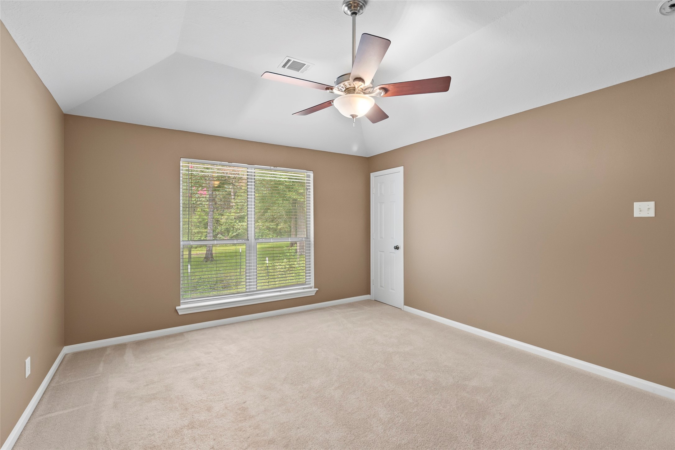 11270 Summit Drive Conroe, TX 77303 - Photo 15 of 35 a view of an empty room with a window