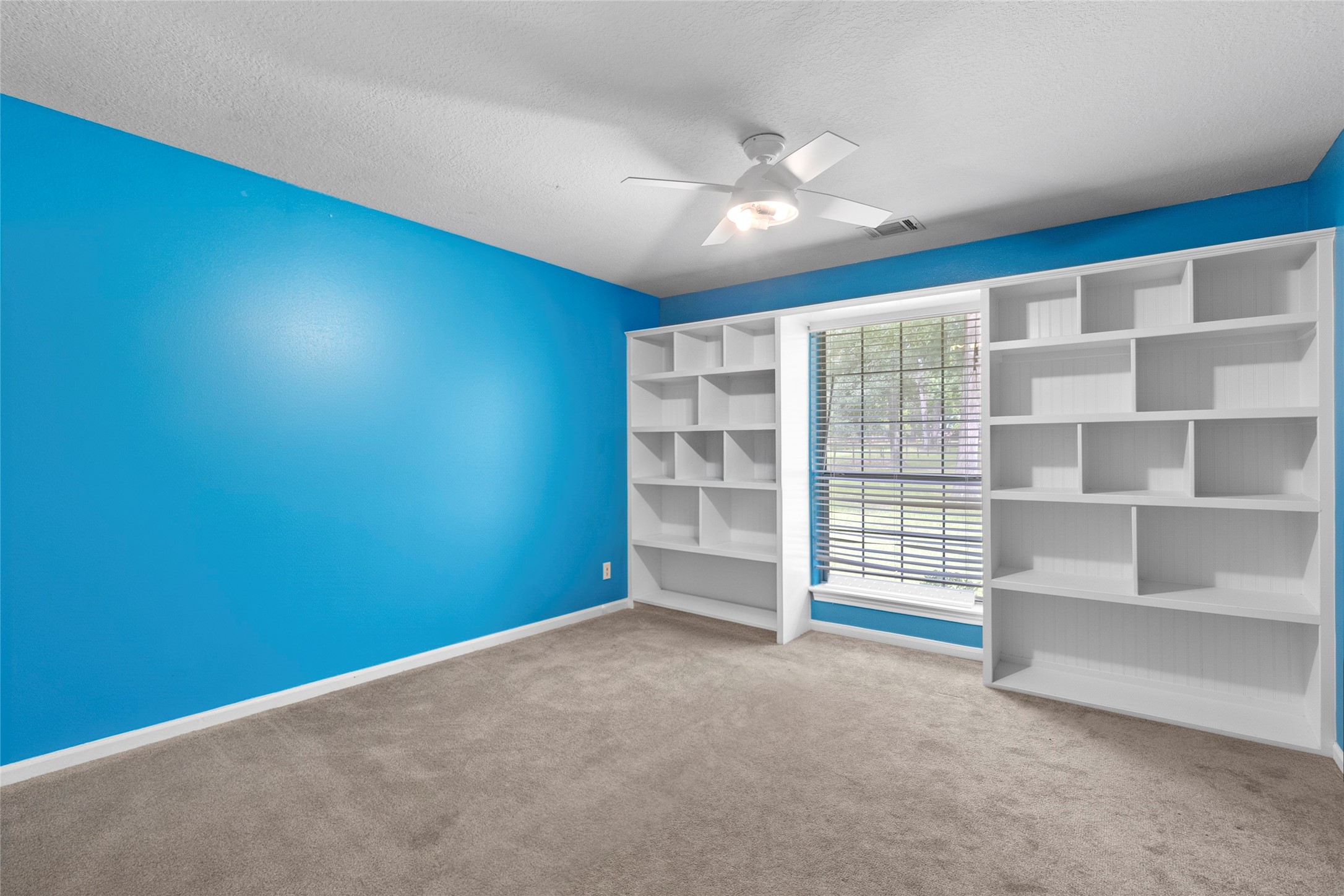 11270 Summit Drive Conroe, TX 77303 - Photo 19 of 35 a view of an empty room with a window