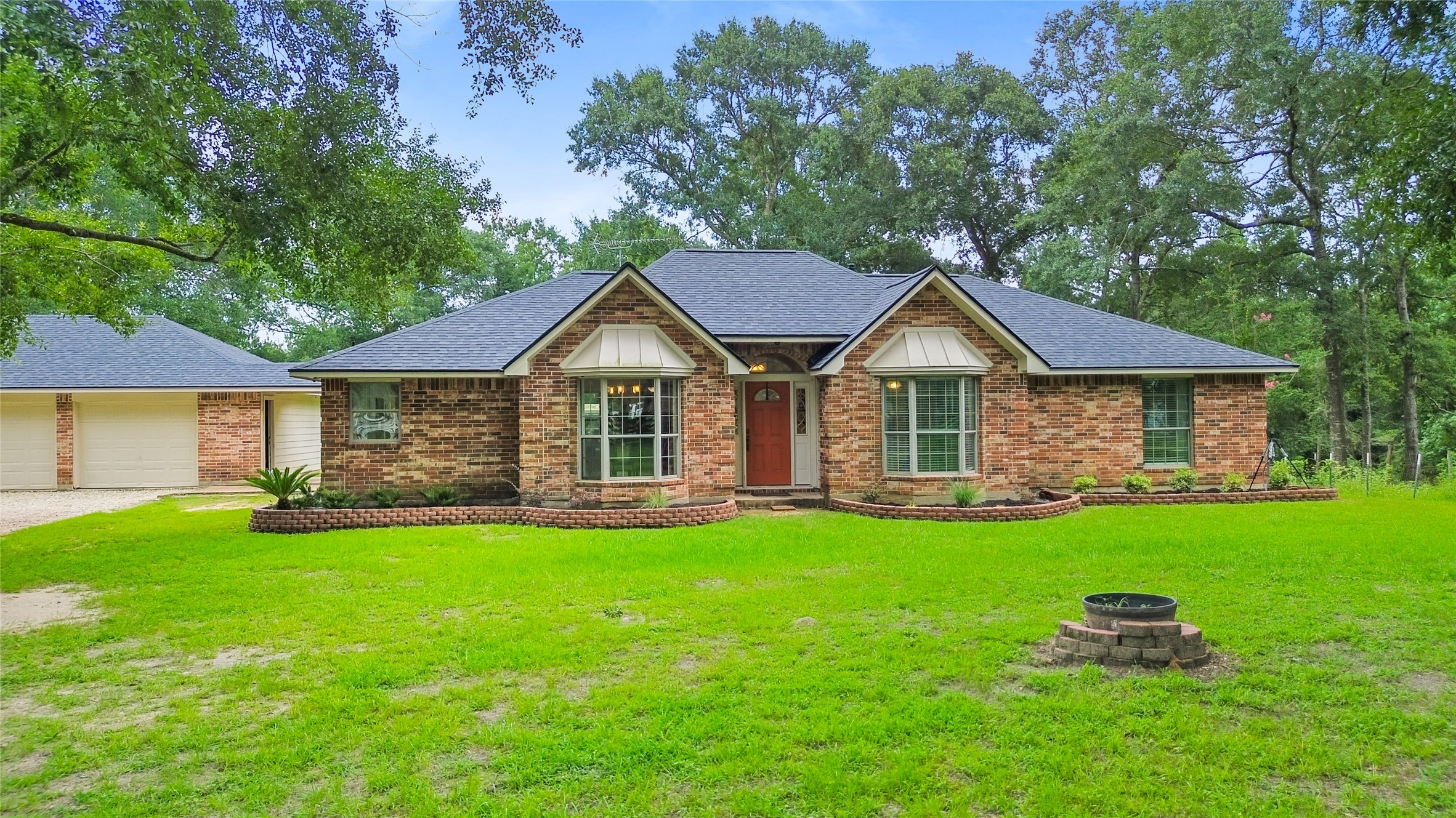 11270 Summit Drive Conroe, TX 77303 - Photo 3 of 35 a front view of a house with a yard