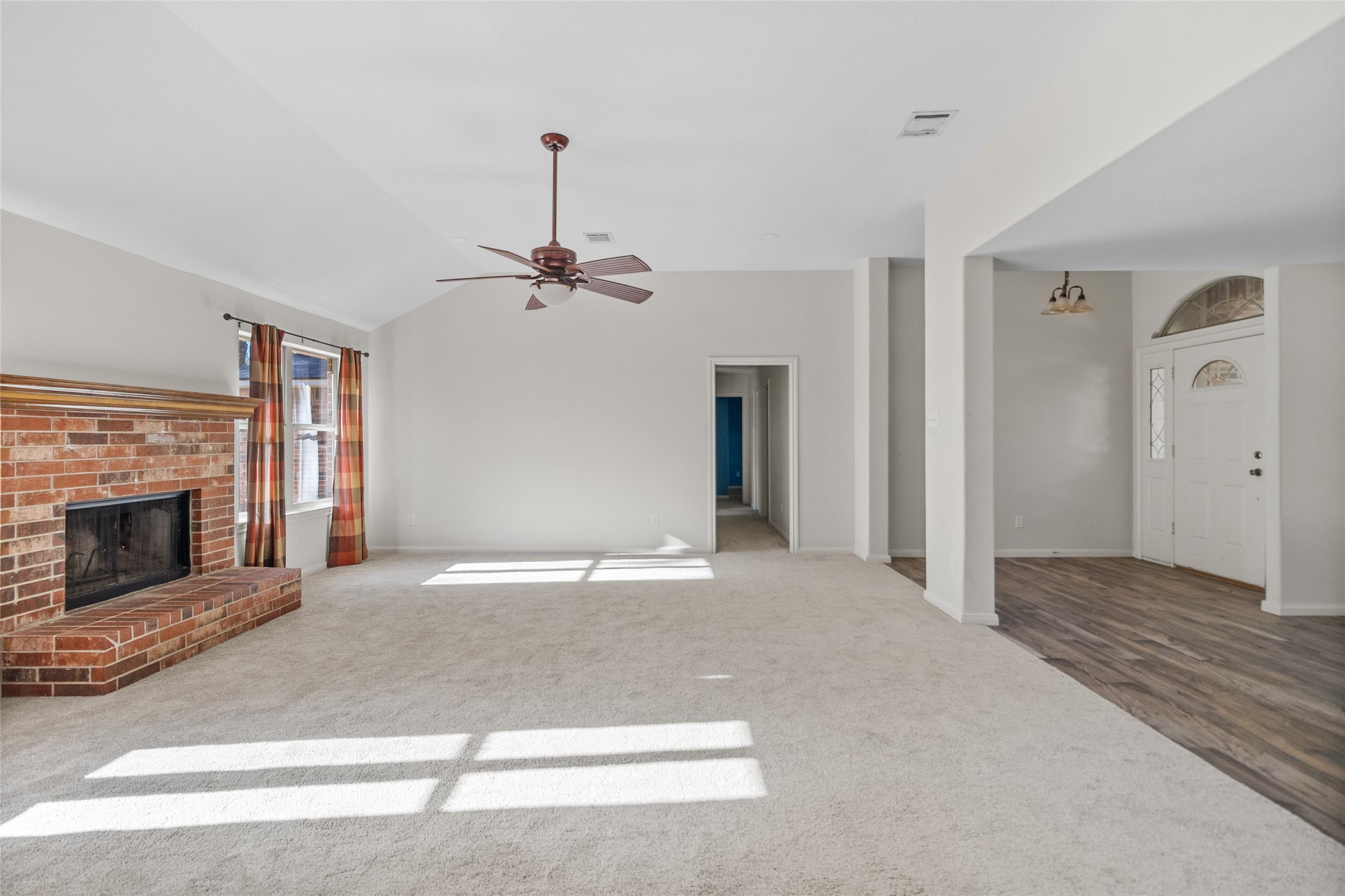 11270 Summit Drive Conroe, TX 77303 - Photo 5 of 35 a view of an empty room with a fireplace and a window