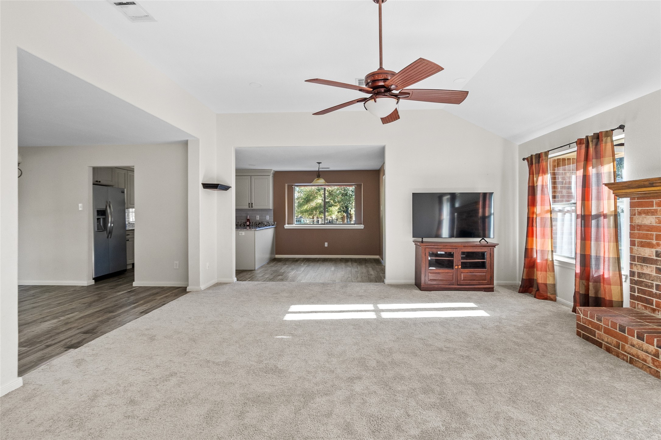 11270 Summit Drive Conroe, TX 77303 - Photo 7 of 35 a view of a livingroom with a flat screen tv and a window