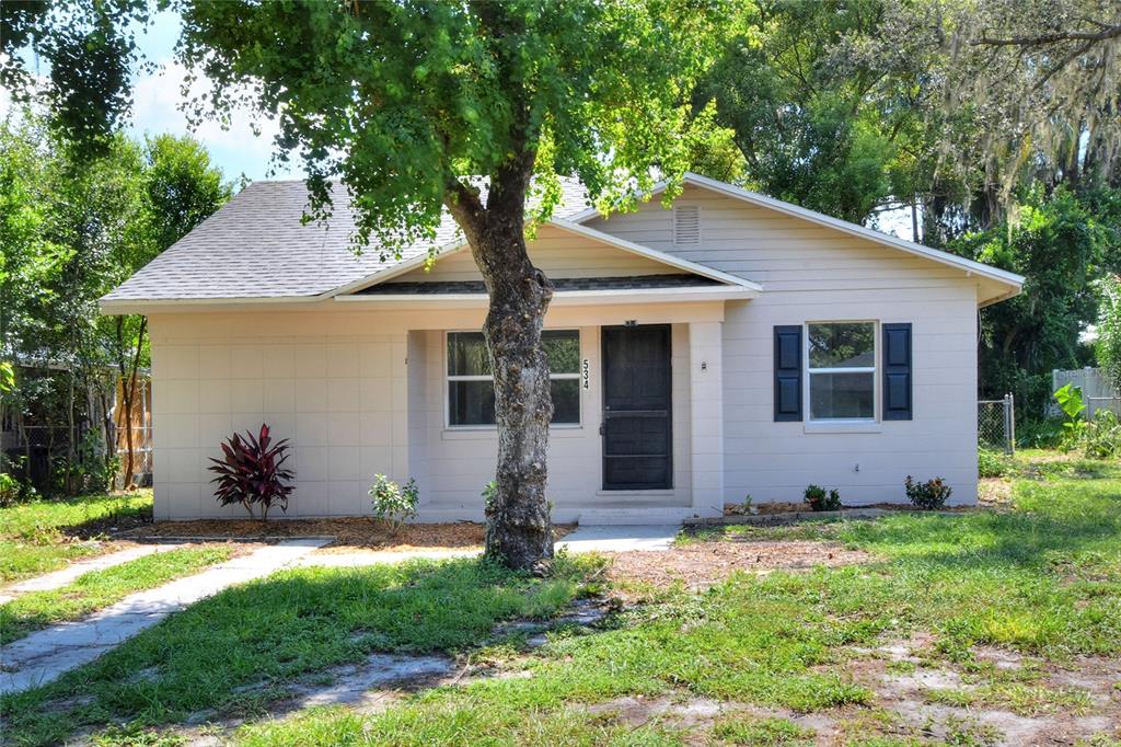 534 Longfellow Boulevard Lakeland, FL 33801 - Photo 1 of 37 a view of a house with yard and a garden