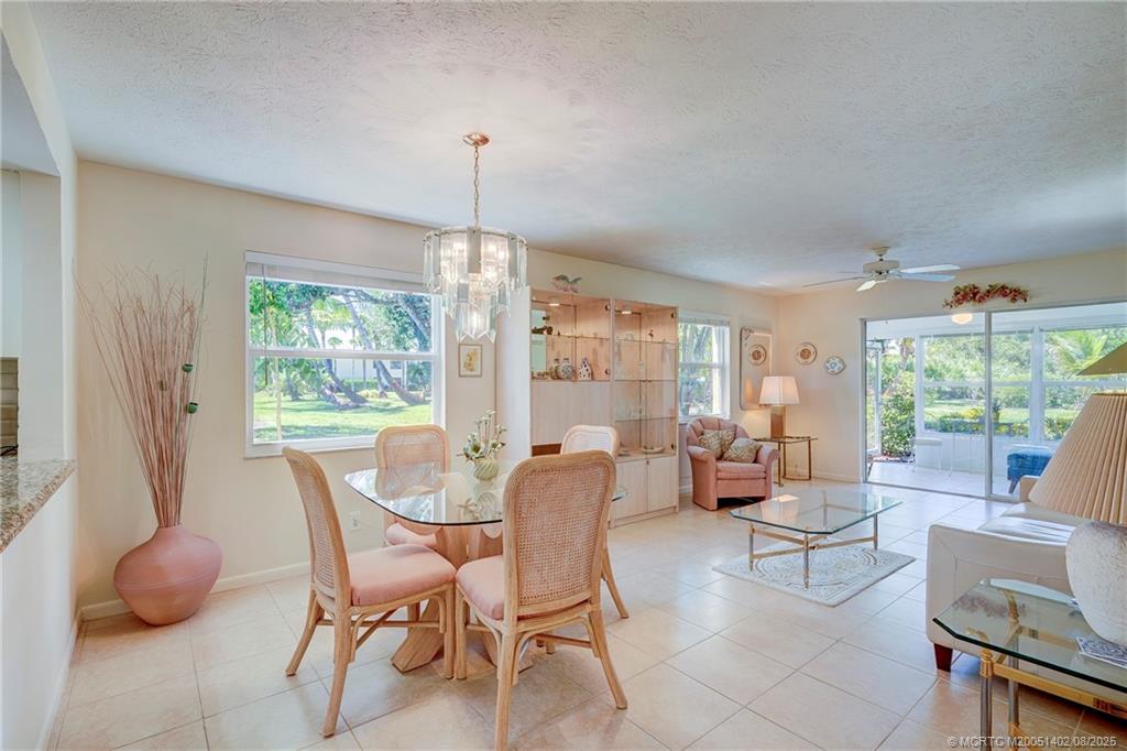 2950 Southeast Ocean Boulevard, Unit 1211 Stuart, FL 34996 - Photo 21 of 61 a view of a dining room with furniture window and outside view