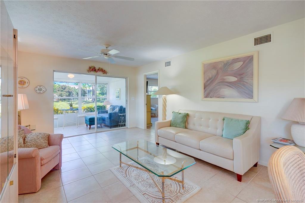 2950 Southeast Ocean Boulevard, Unit 1211 Stuart, FL 34996 - Photo 23 of 61 a living room with furniture and a large window