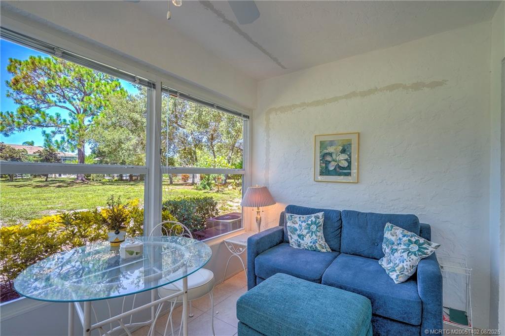 2950 Southeast Ocean Boulevard, Unit 1211 Stuart, FL 34996 - Photo 36 of 61 a living room with furniture and a large window