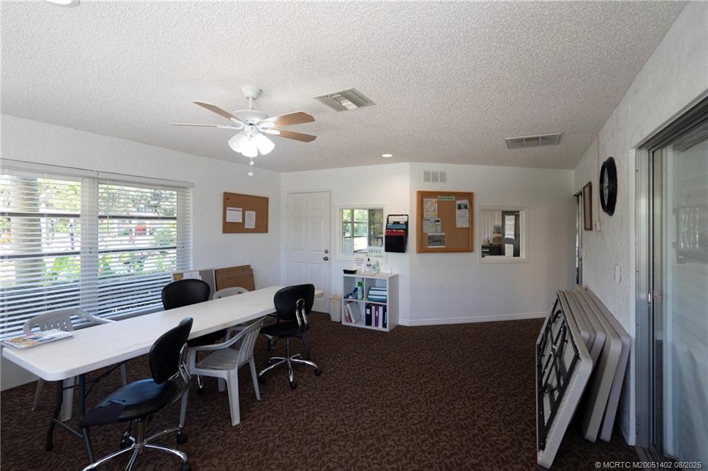 2950 Southeast Ocean Boulevard, Unit 1211 Stuart, FL 34996 - Photo 43 of 61 a view of a dining room with furniture and a window