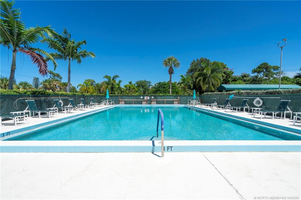 2950 Southeast Ocean Boulevard, Unit 1211 Stuart, FL 34996 - Photo 45 of 61 a view of a swimming pool and an outdoor space