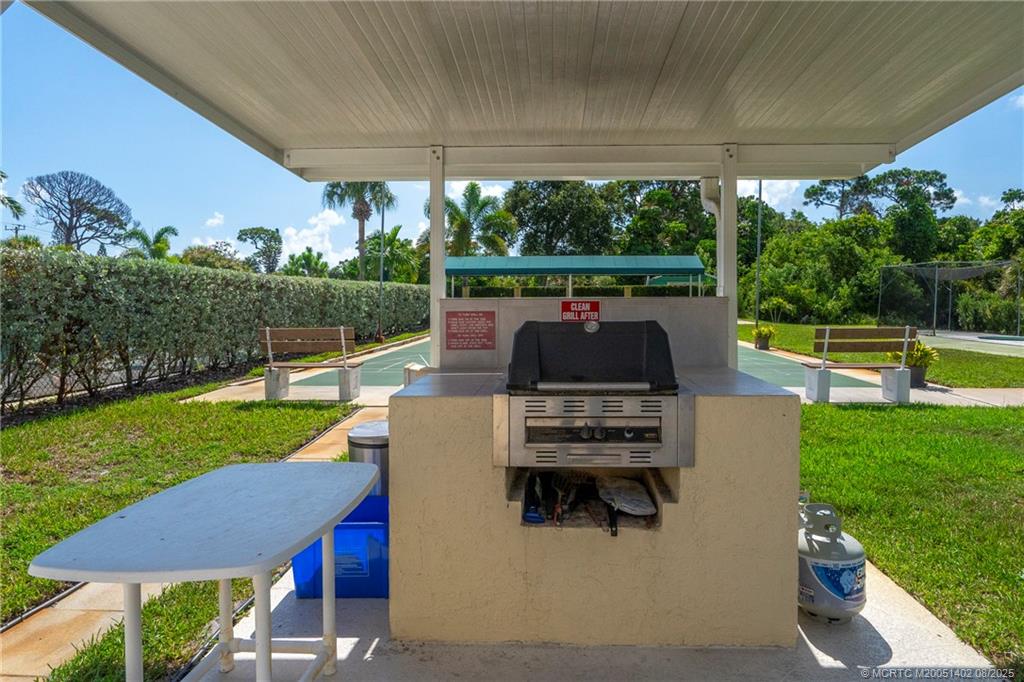 2950 Southeast Ocean Boulevard, Unit 1211 Stuart, FL 34996 - Photo 55 of 61 a view of a patio with a yard