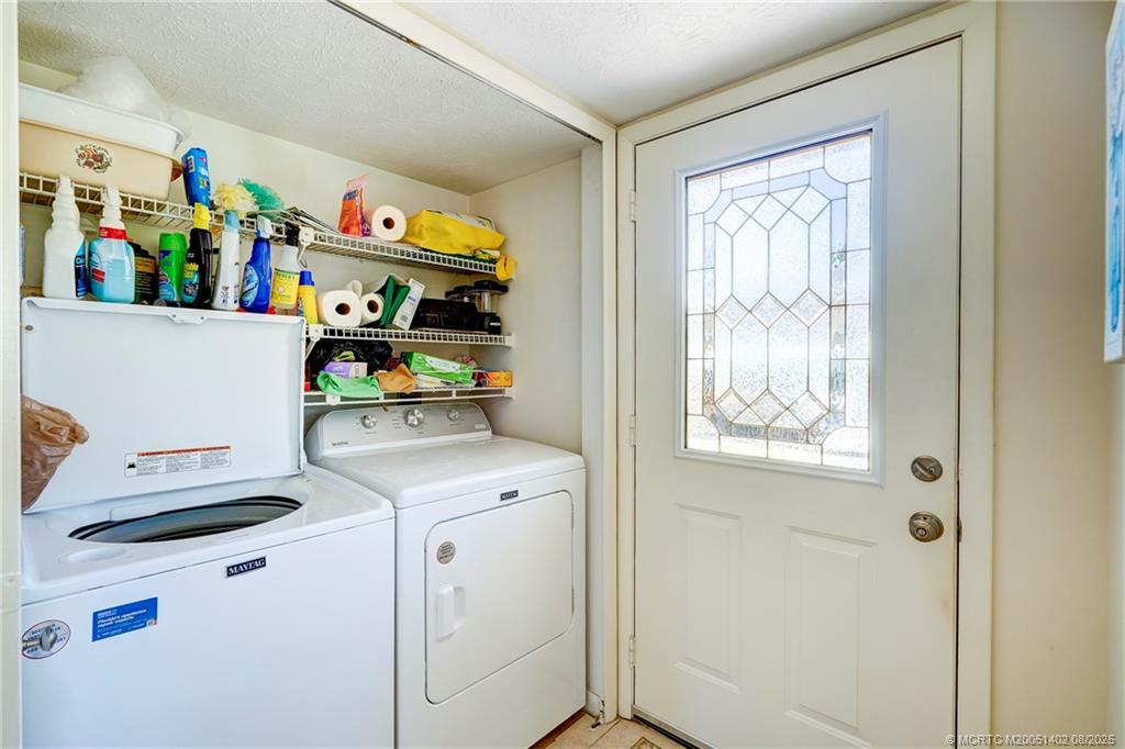 2950 Southeast Ocean Boulevard, Unit 1211 Stuart, FL 34996 - Photo 8 of 61 a view of storage and utility room with washer and dryer