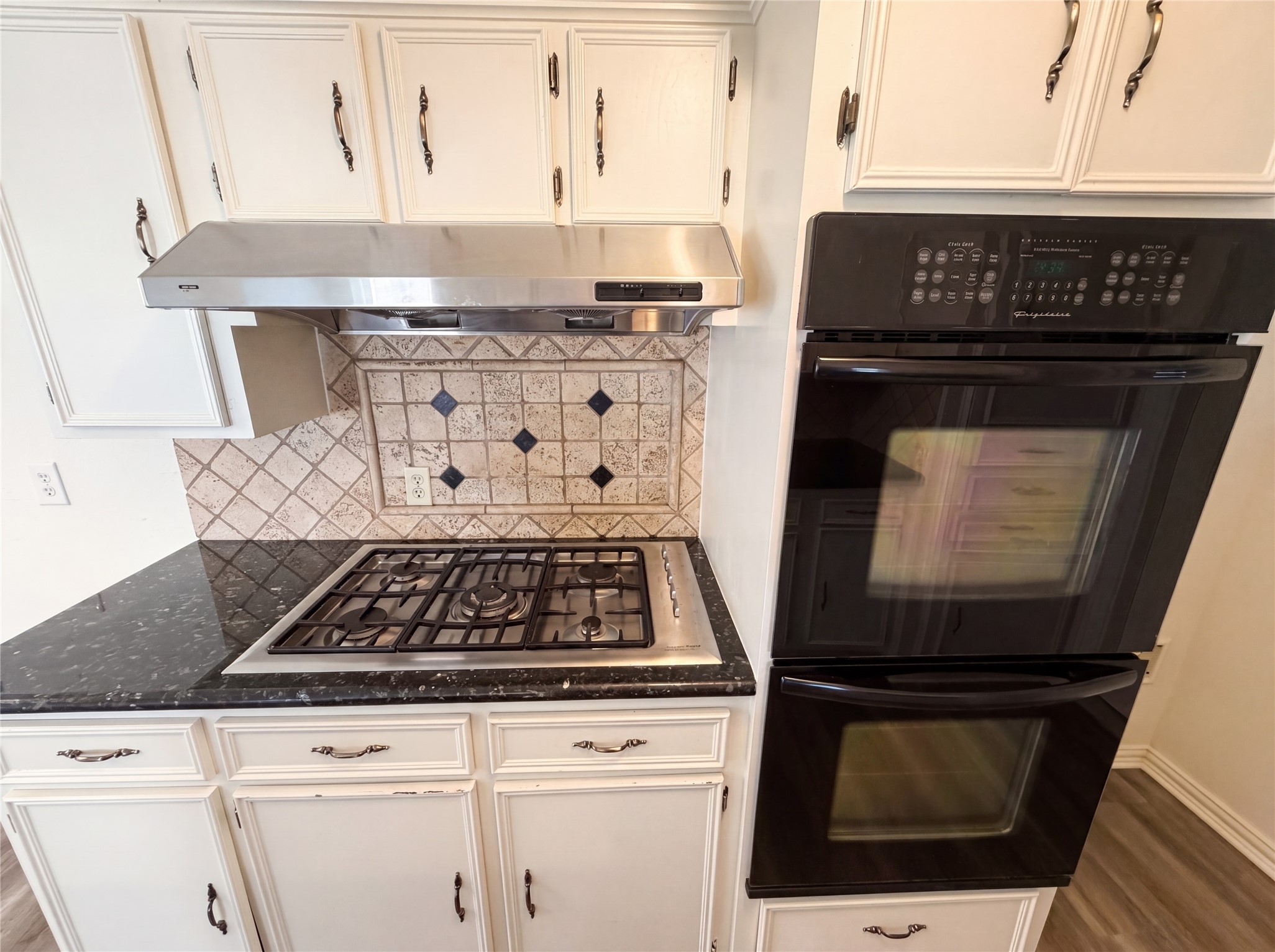 342 Queenstown Road Houston, TX 77015 - Photo 8 of 22 a stove top oven sitting inside of a kitchen