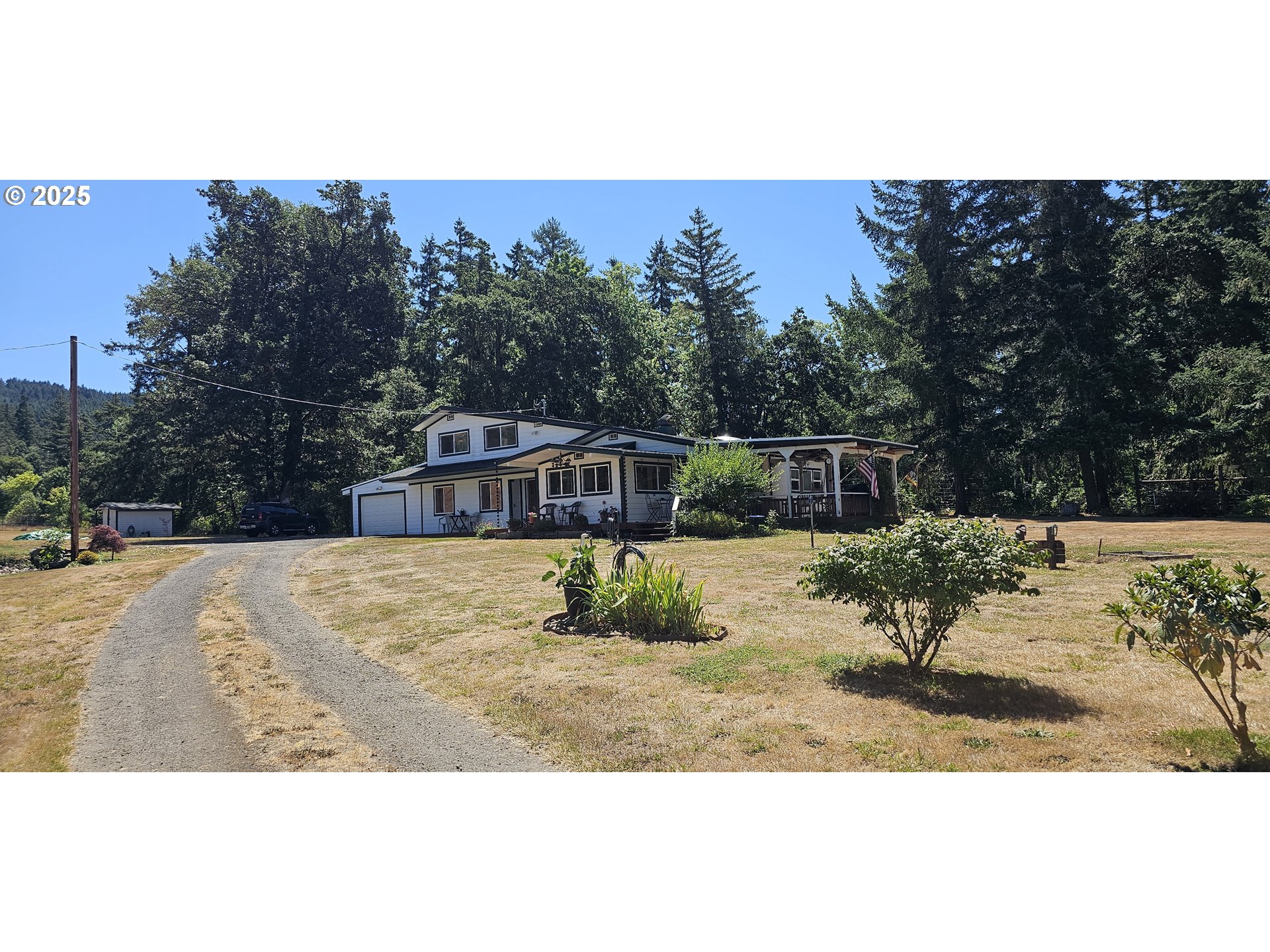524 Azalea Drive Elkton, OR 97436 - Photo 1 of 48 a view of a house with a yard covered in snow