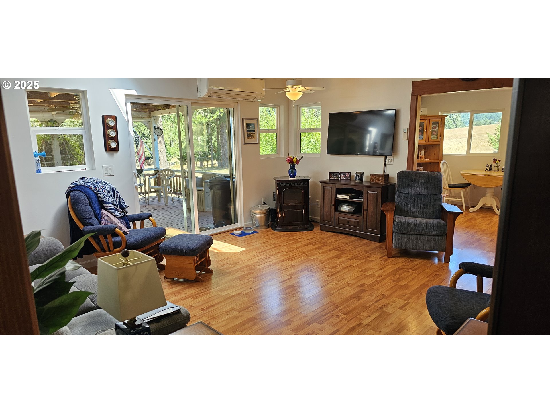 524 Azalea Drive Elkton, OR 97436 - Photo 11 of 48 a living room with furniture and a flat screen tv