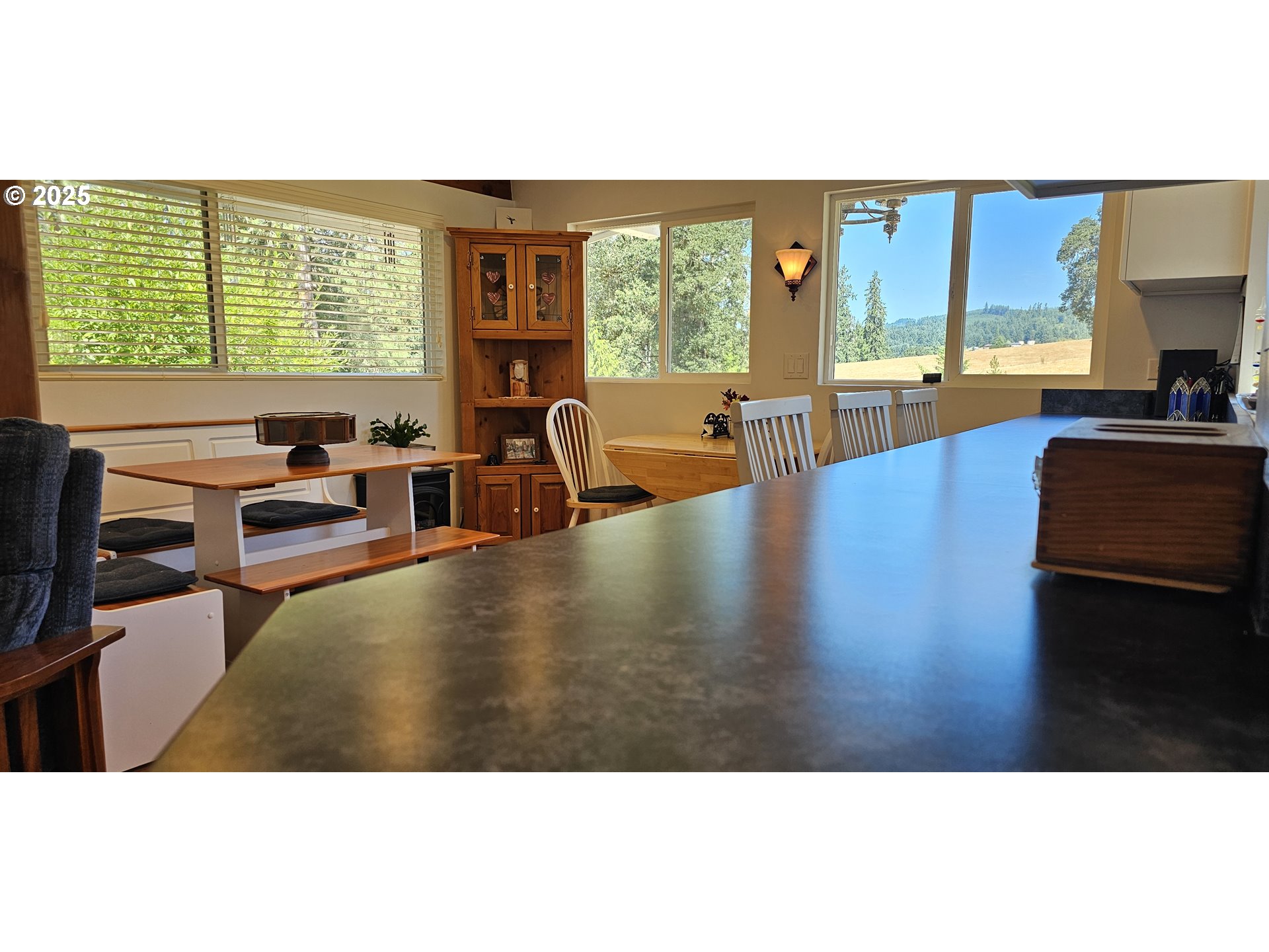 524 Azalea Drive Elkton, OR 97436 - Photo 12 of 48 a living room with furniture and large windows