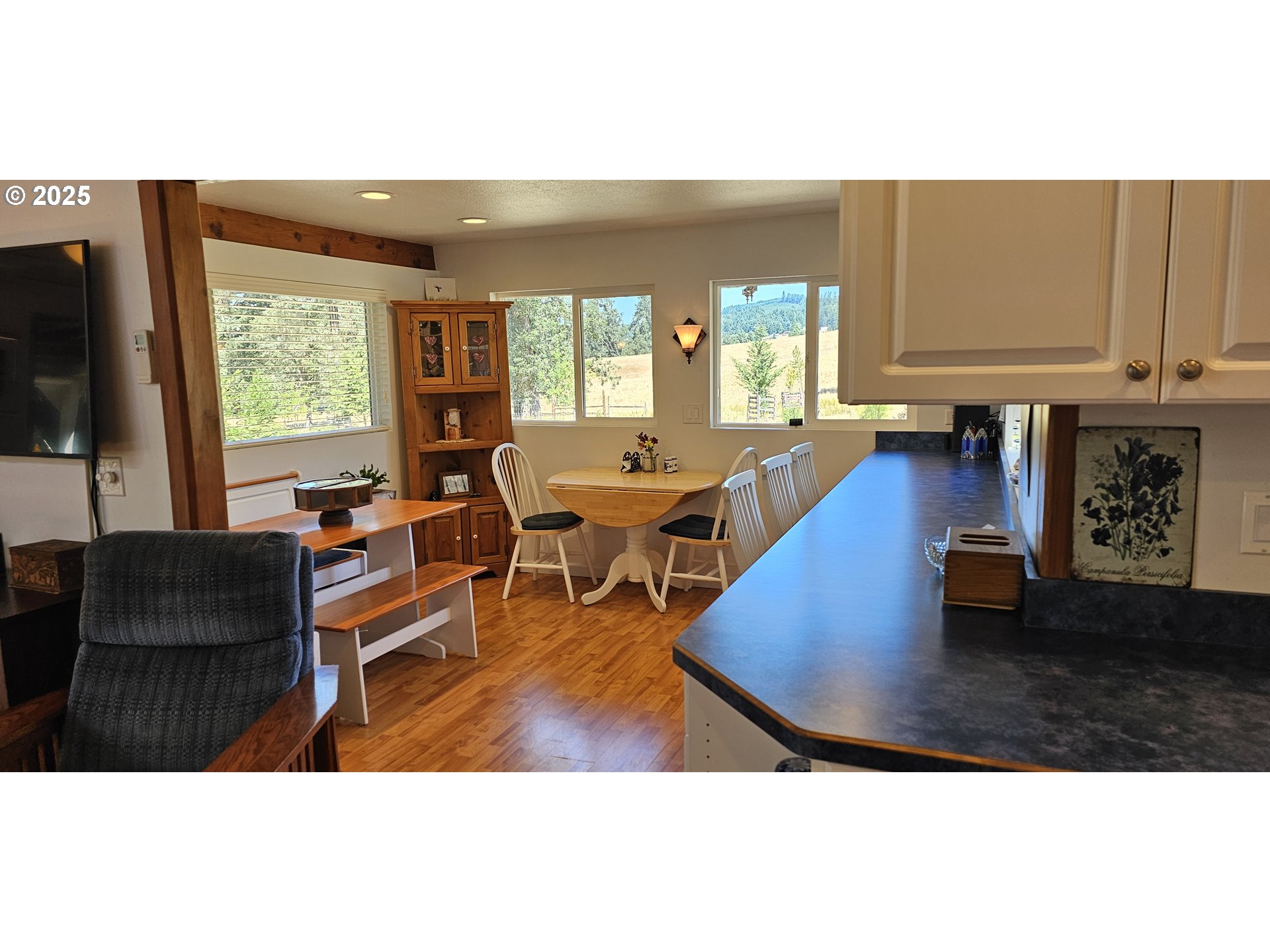 524 Azalea Drive Elkton, OR 97436 - Photo 13 of 48 a living room with furniture and a flat screen tv