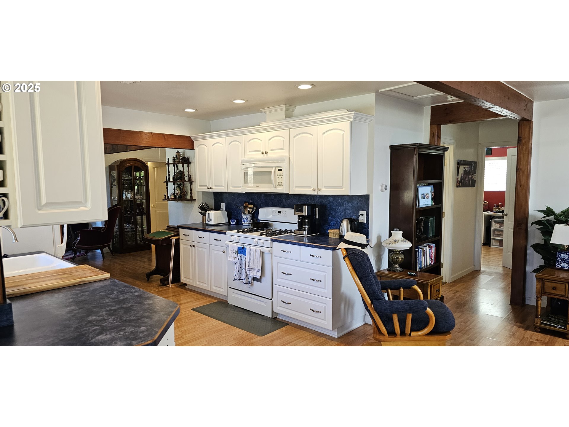 524 Azalea Drive Elkton, OR 97436 - Photo 15 of 48 a living room with stainless steel appliances kitchen island granite countertop furniture and a view of kitchen
