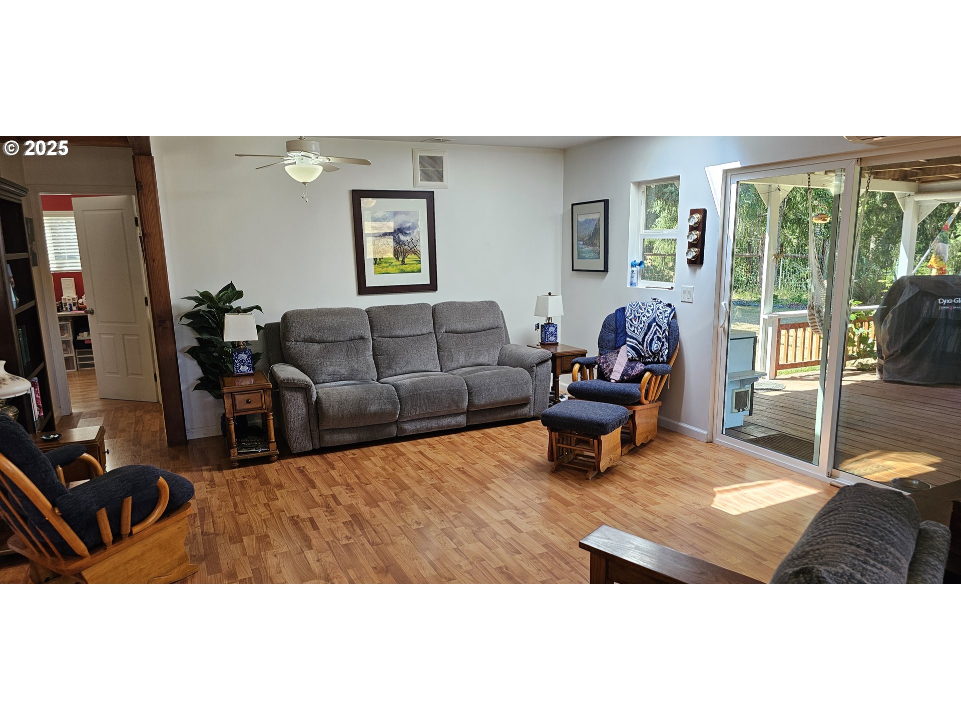 524 Azalea Drive Elkton, OR 97436 - Photo 17 of 48 a living room with furniture and a flat screen tv