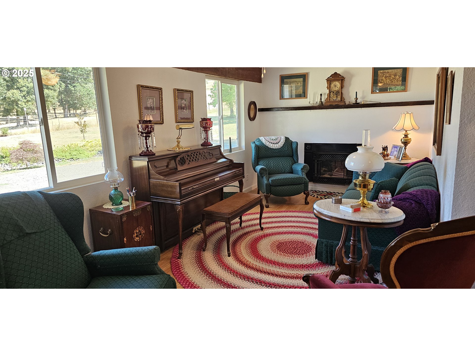 524 Azalea Drive Elkton, OR 97436 - Photo 19 of 48 a living room with furniture and a fireplace