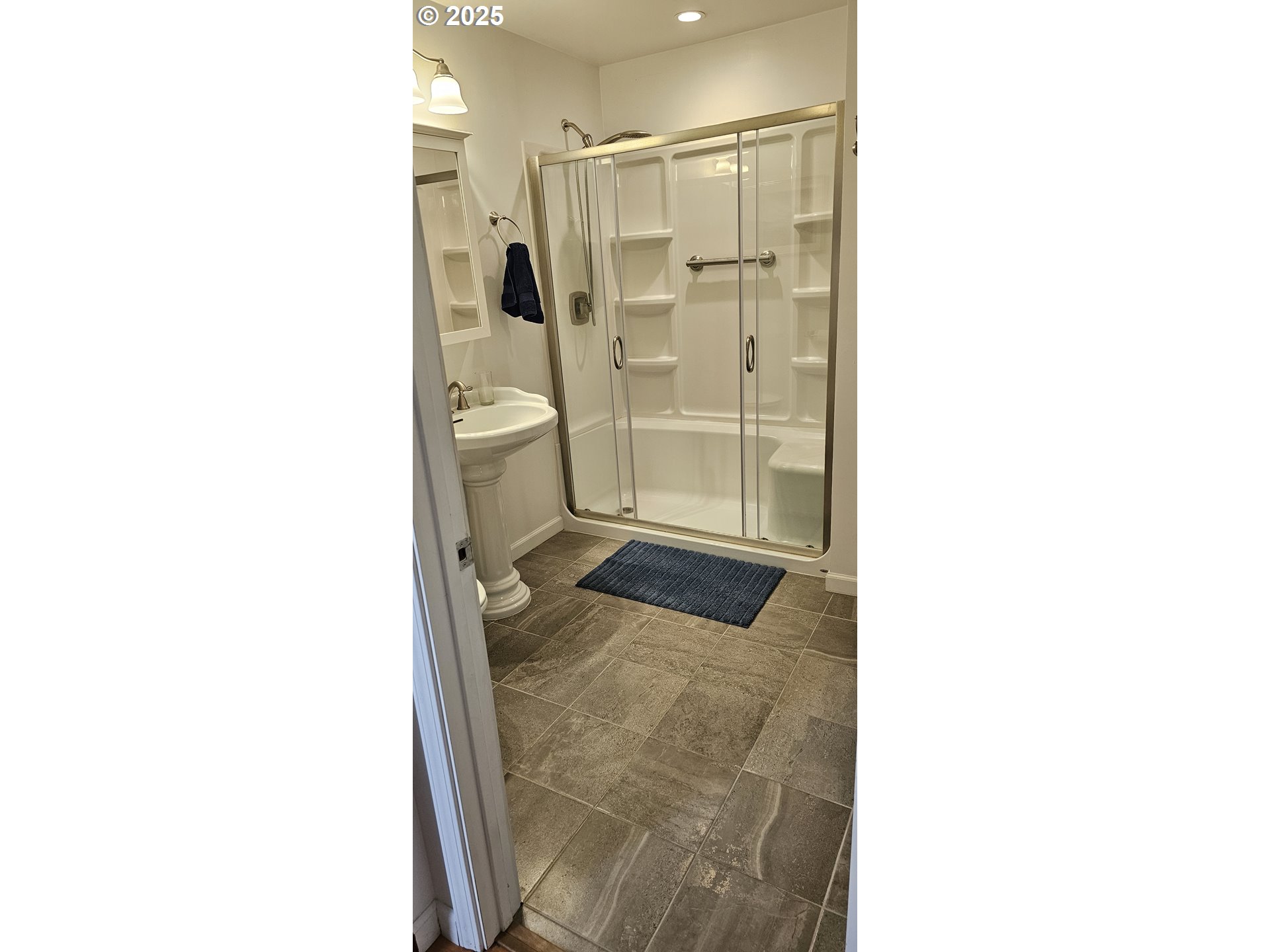 524 Azalea Drive Elkton, OR 97436 - Photo 22 of 48 a bathroom with a sink and a shower