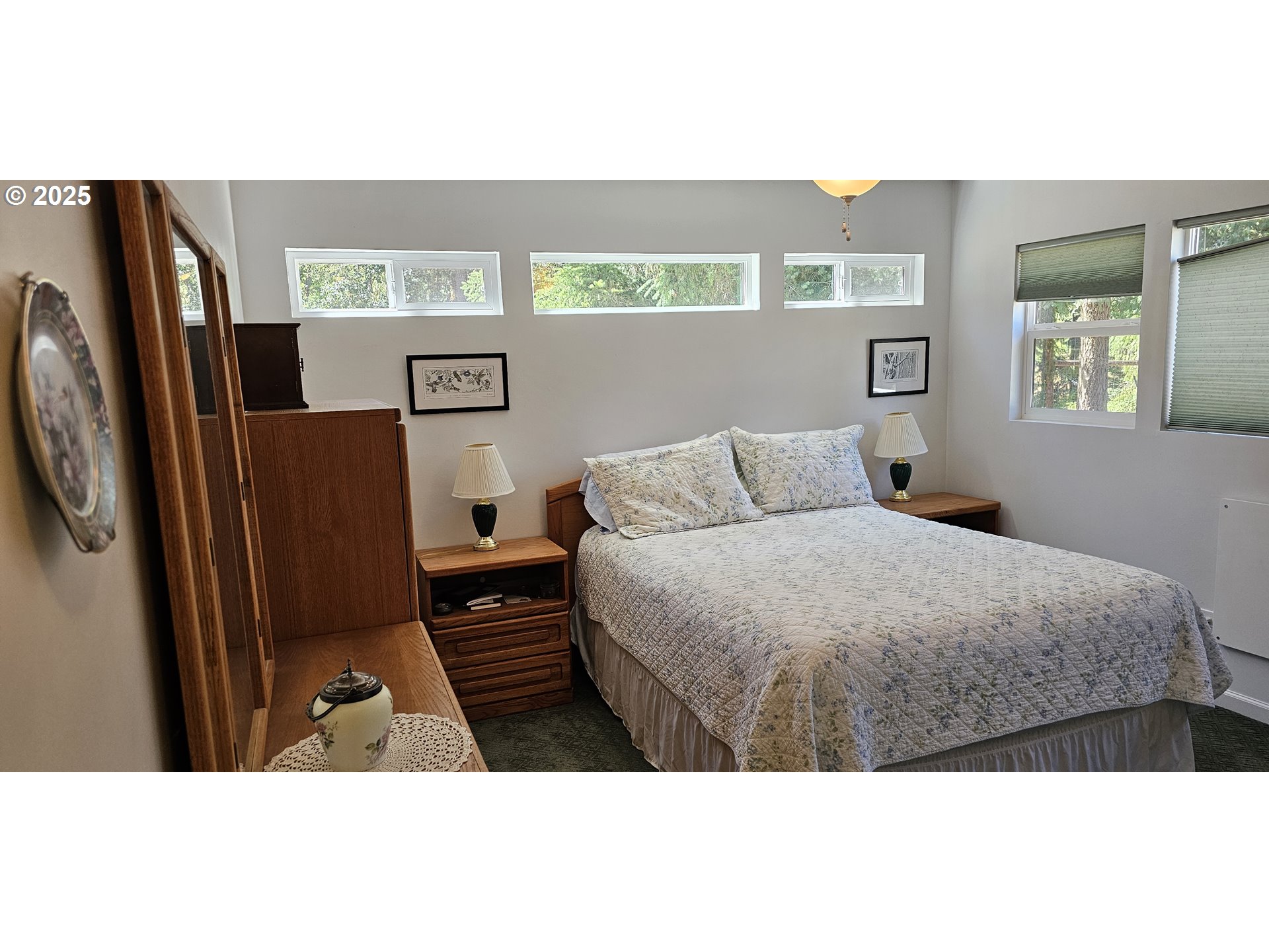 524 Azalea Drive Elkton, OR 97436 - Photo 27 of 48 a bedroom with a bed and a dresser