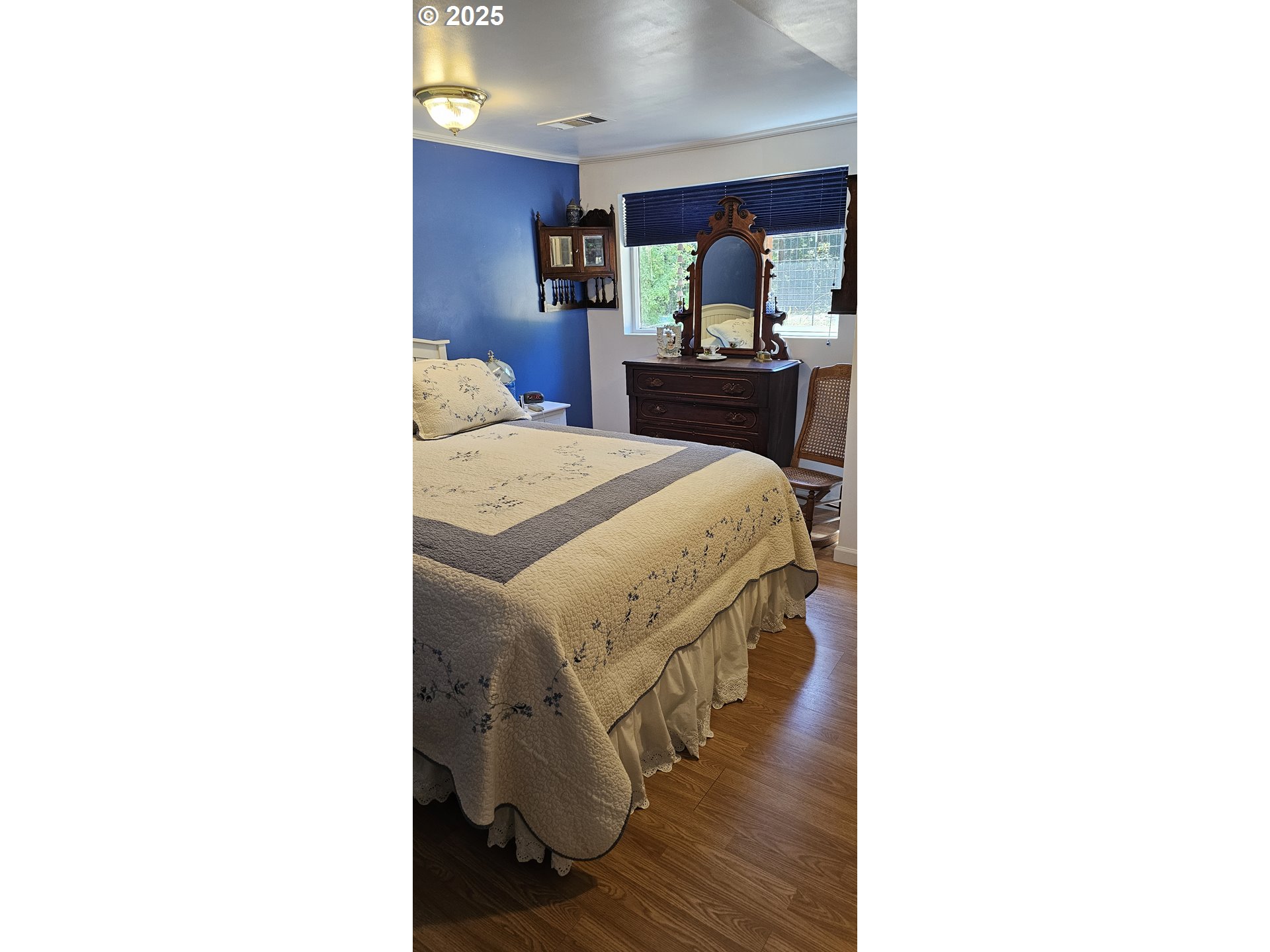 524 Azalea Drive Elkton, OR 97436 - Photo 30 of 48 a bedroom with a bed and a dresser