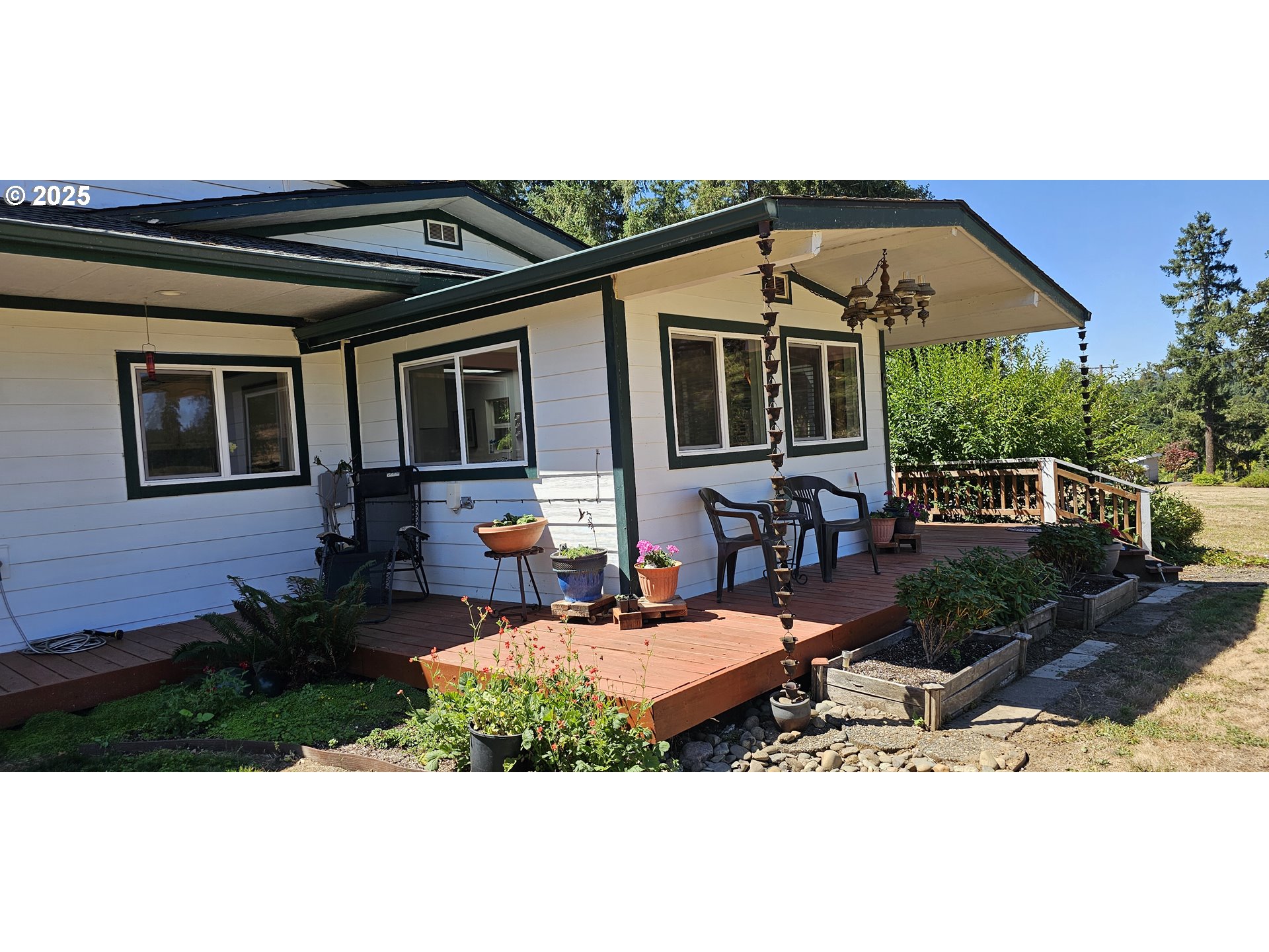 524 Azalea Drive Elkton, OR 97436 - Photo 3 of 48 a view of a house with backyard porch and sitting area