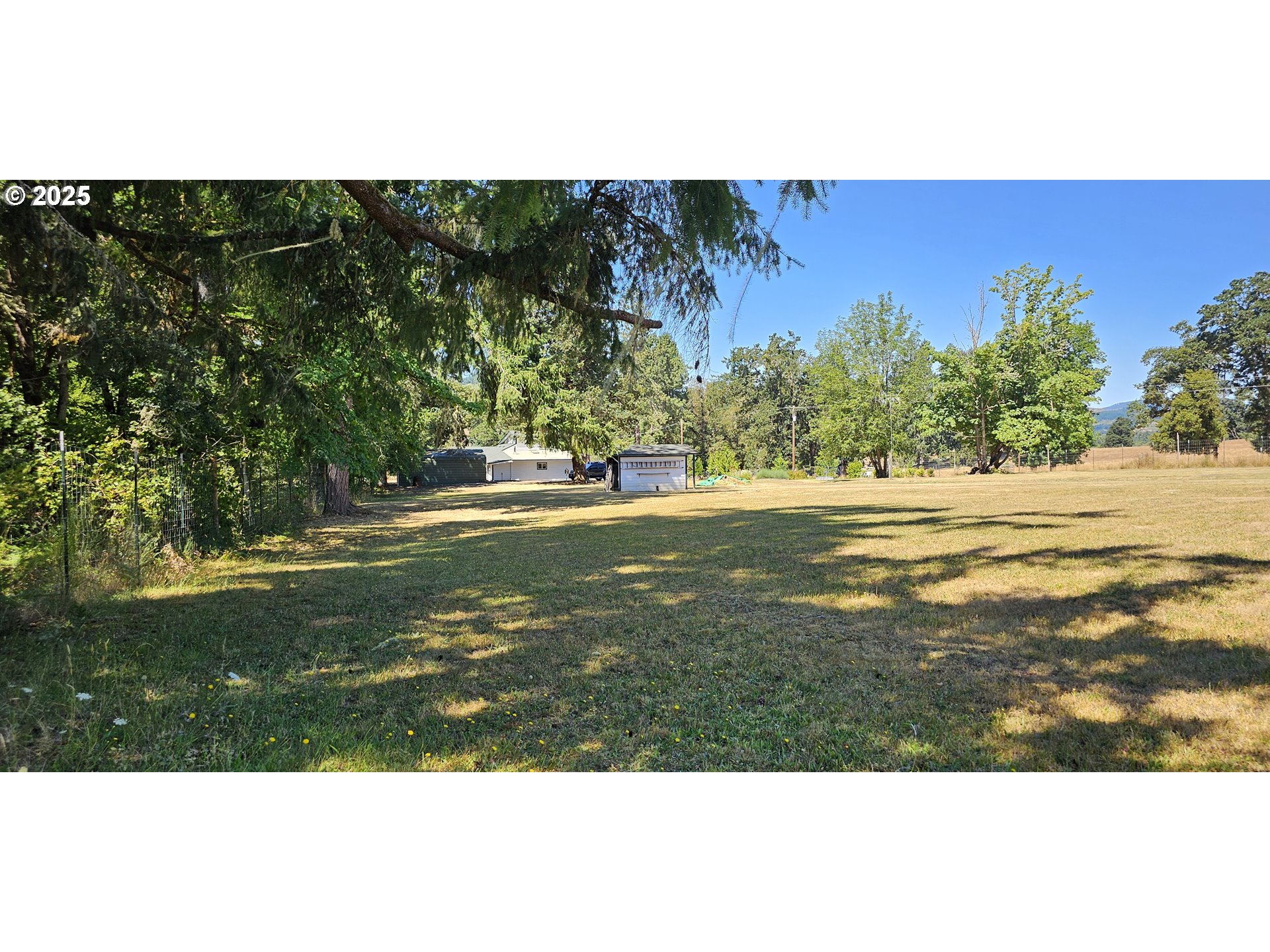 524 Azalea Drive Elkton, OR 97436 - Photo 6 of 48 a view of a field with an ocean