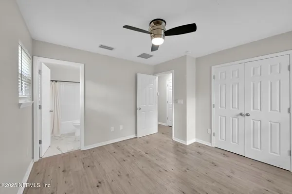 a view of a livingroom with wooden floor