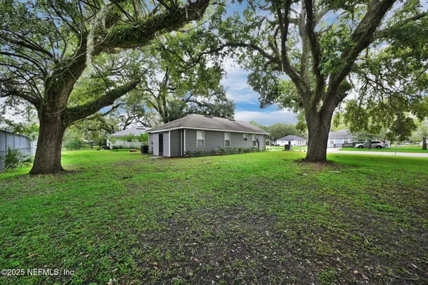 a backyard of a house with lots of green space