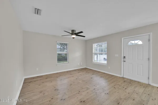 a view of an empty room with a window