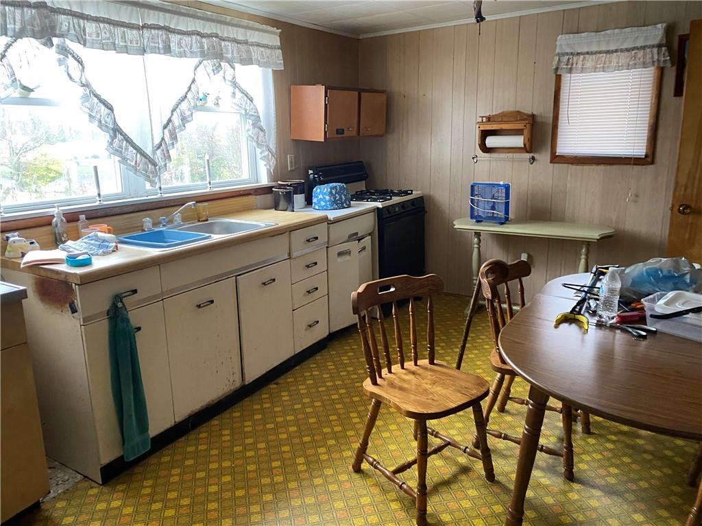 140 Balsinger Road Uniontown, PA 15401 - Photo 2 of 8 a kitchen with sink cabinets and a table