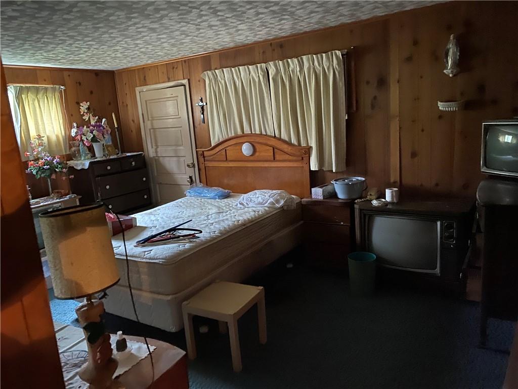 140 Balsinger Road Uniontown, PA 15401 - Photo 5 of 8 a room with a table chairs and a refrigerator