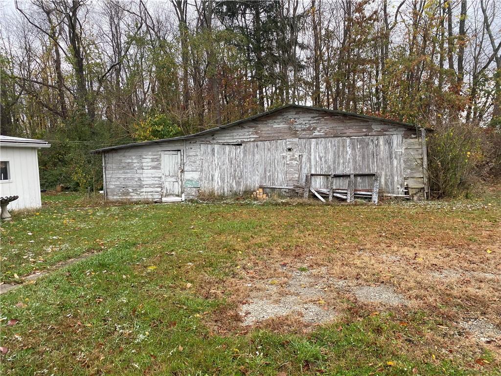 140 Balsinger Road Uniontown, PA 15401 - Photo 7 of 8 a backyard of a house with table and chairs