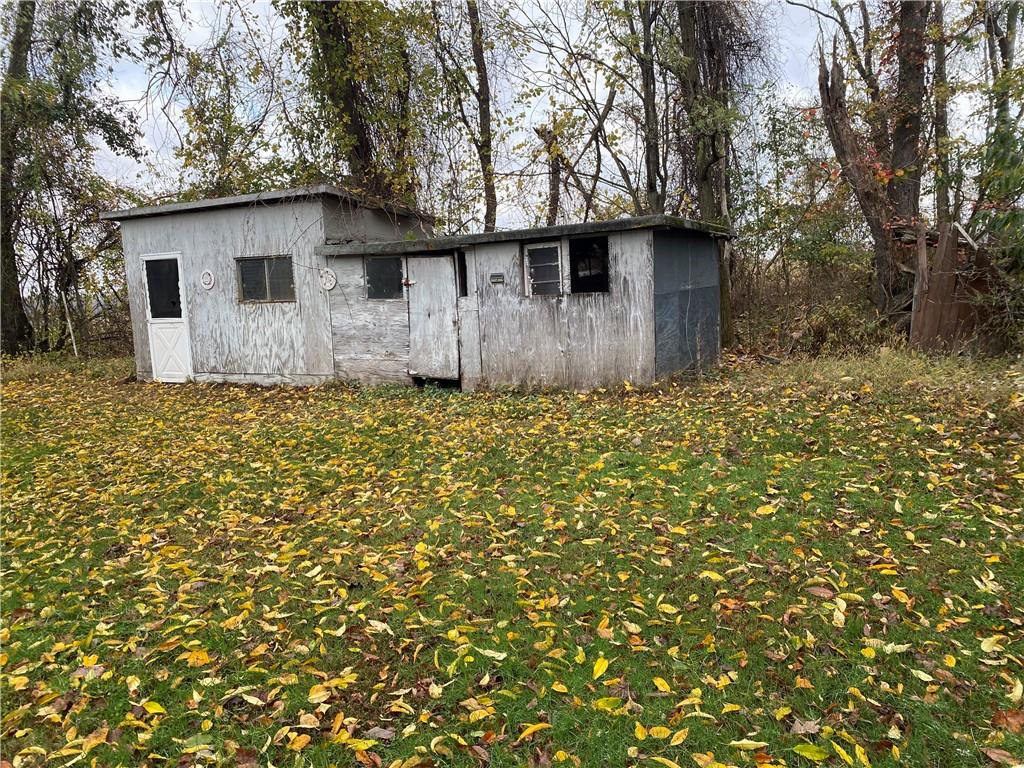140 Balsinger Road Uniontown, PA 15401 - Photo 8 of 8 a white house that has a tree in front of it