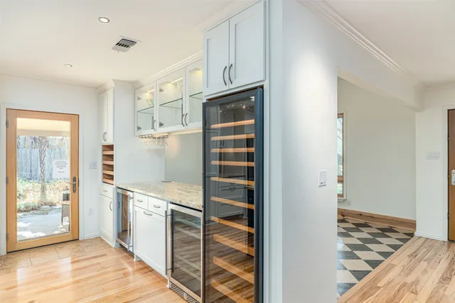 a view of a room with wooden floor