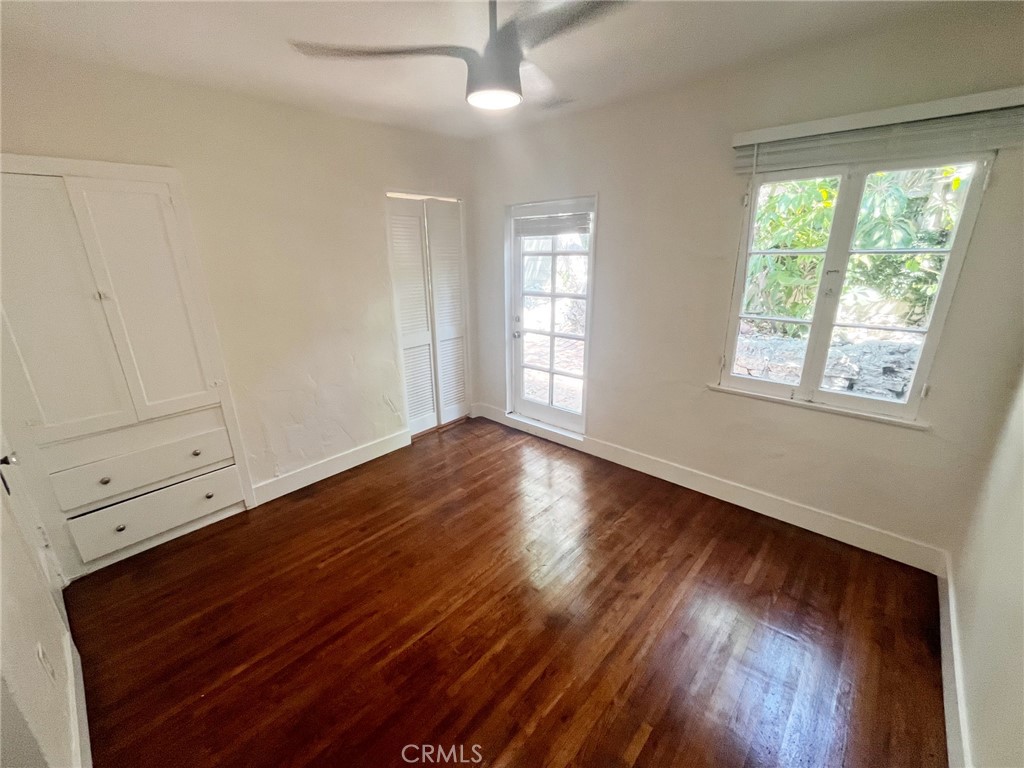 33910 Orilla Road, Unit 7 Dana Point, CA 92629 - Photo 19 of 50 a view of an empty room with wooden floor and a window