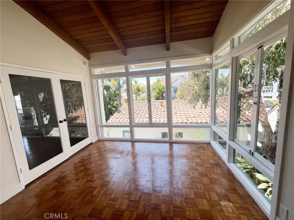 33910 Orilla Road, Unit 7 Dana Point, CA 92629 - Photo 6 of 50 a view of an empty room with wooden floor and a window
