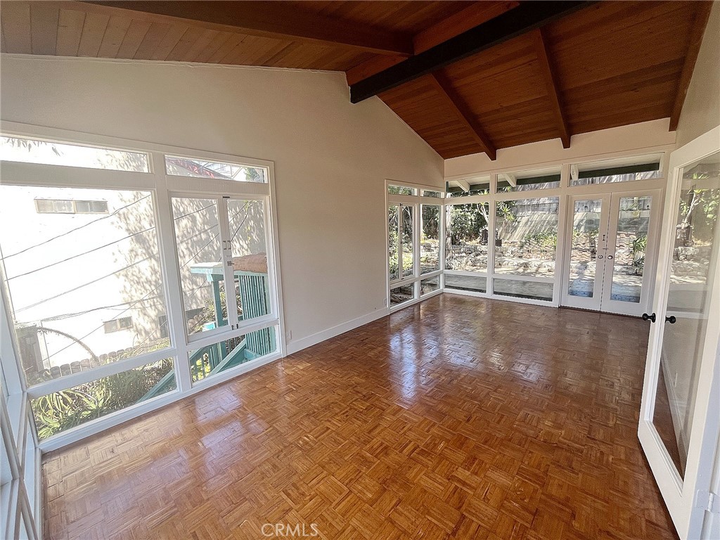 33910 Orilla Road, Unit 7 Dana Point, CA 92629 - Photo 9 of 50 a view of empty room with wooden floor and fan