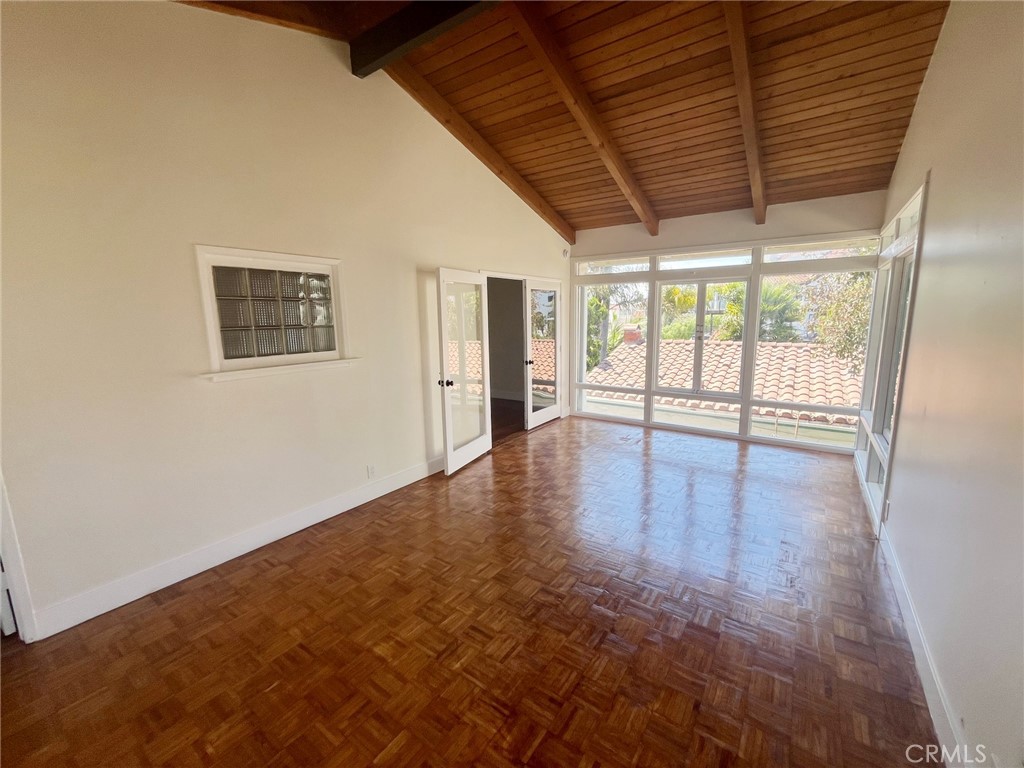 33910 Orilla Road, Unit 7 Dana Point, CA 92629 - Photo 10 of 50 a view of an empty room with wooden floor and a window