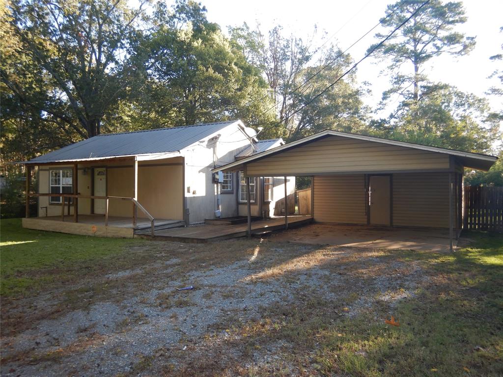 910 Lee Street Benton, LA 71006 - Photo 1 of 1 a view of a house with a yard and large tree