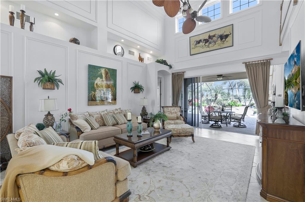 9104 Quartz Lane Naples, FL 34120 - Photo 14 of 47 a living room with furniture and a large window
